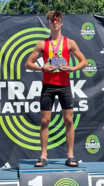 Teen athlete on the Track Nationals podium holding medals