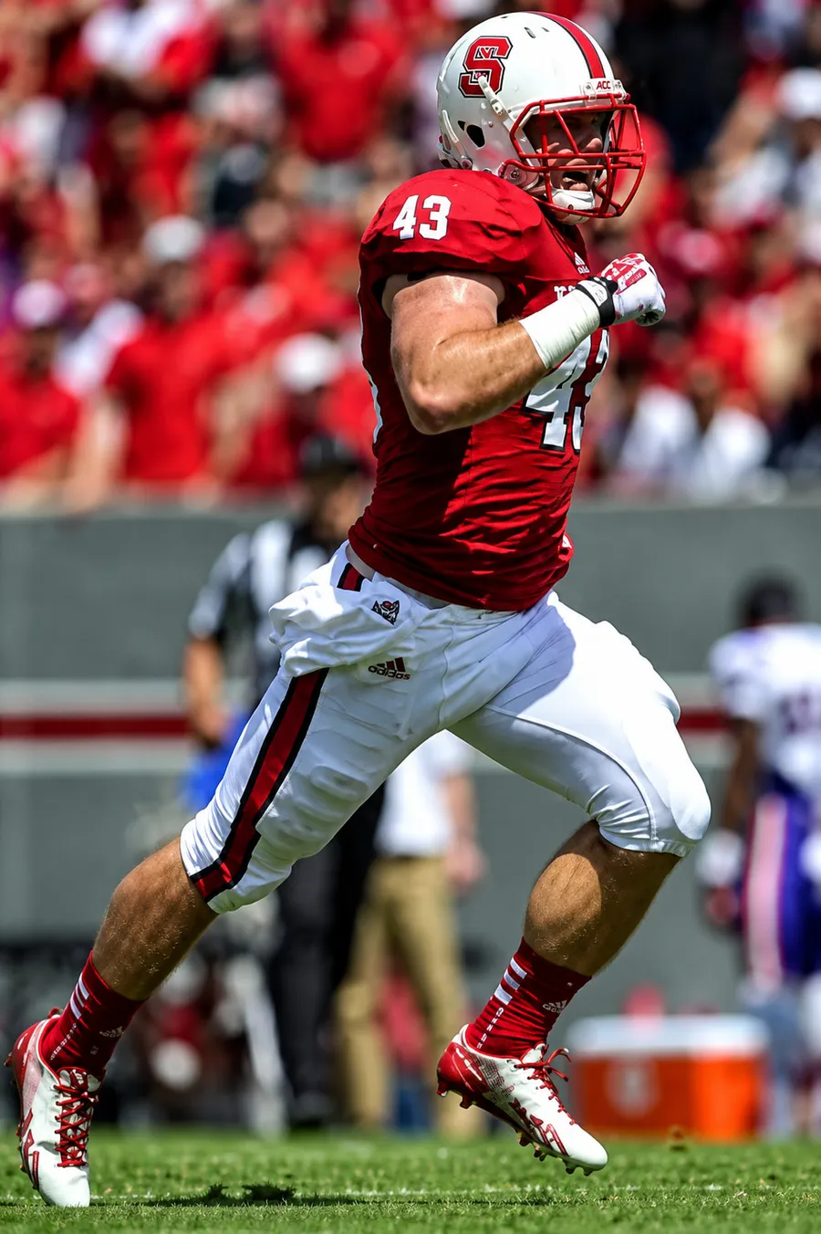 Ryan Cheek, founder of Momentum Athletic Performance, playing linebacker for NC State University