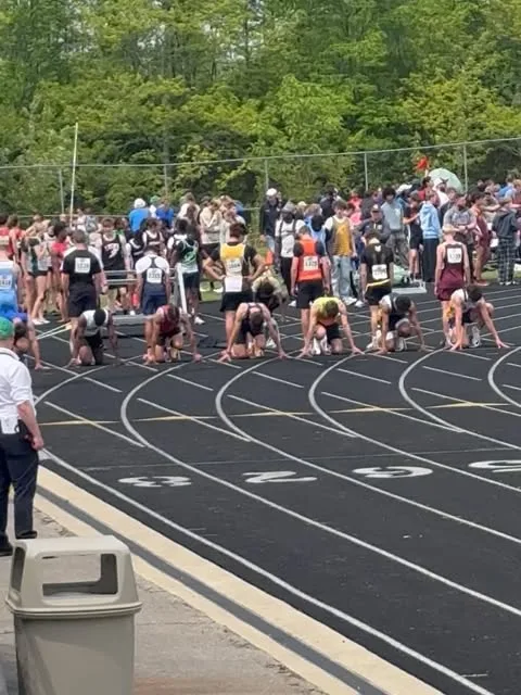 Momentum Track Club athletes at a summer meet